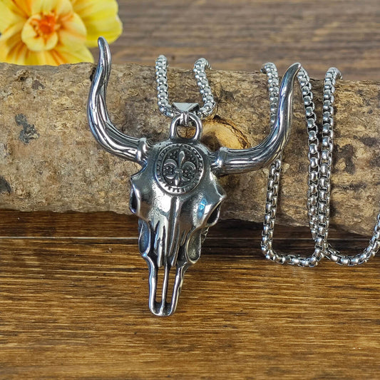 A silver necklace in the shape of a longhorn bull, western style