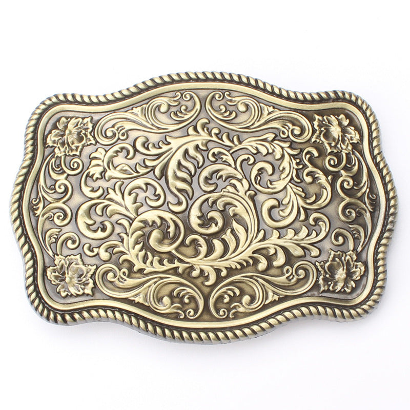 Bronze arabic-style belt buckle with detailed arabesque engraving.