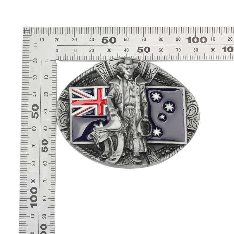 Australian flag cowboy belt buckle shown with ruler for size reference, fits standard belts.