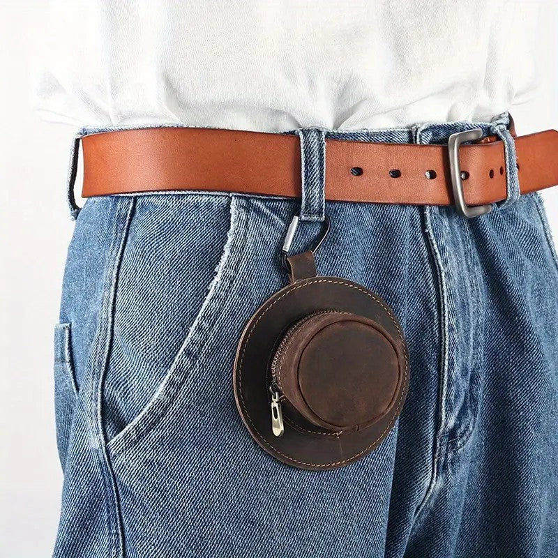 Cowboy hat leather coin pouch hanging on a belt, worn at the waist as a western-style accessory.