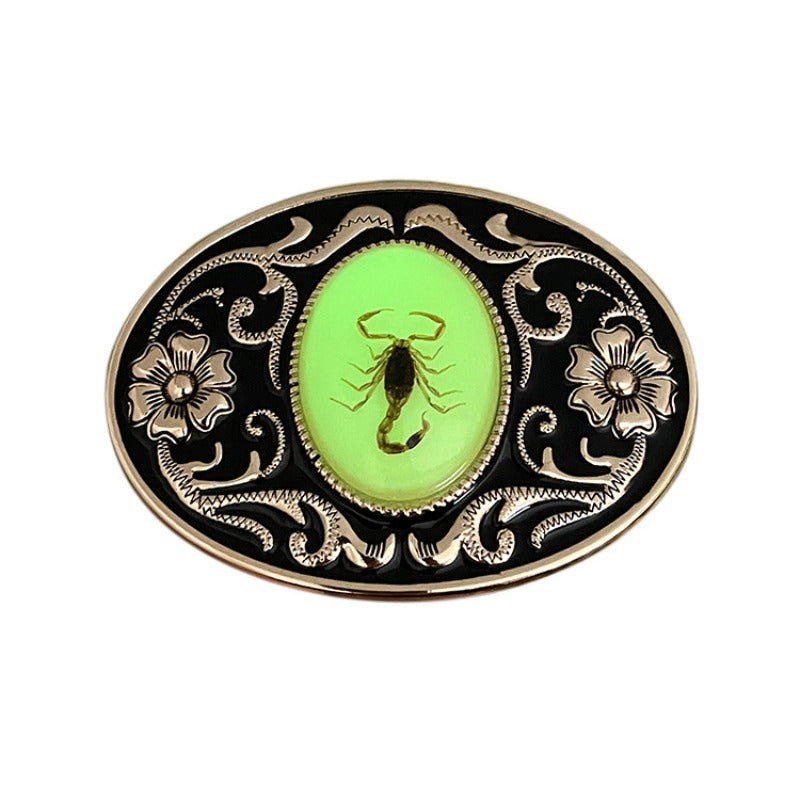 Gold belt buckle featuring luminous scorpion in bold rugged design.