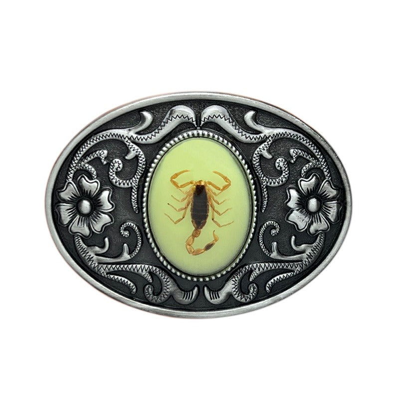 Silver belt buckle with glow-in-the-dark scorpion, western punk style.