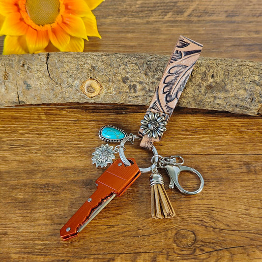 Red cowboy-style keychain with Western engraving