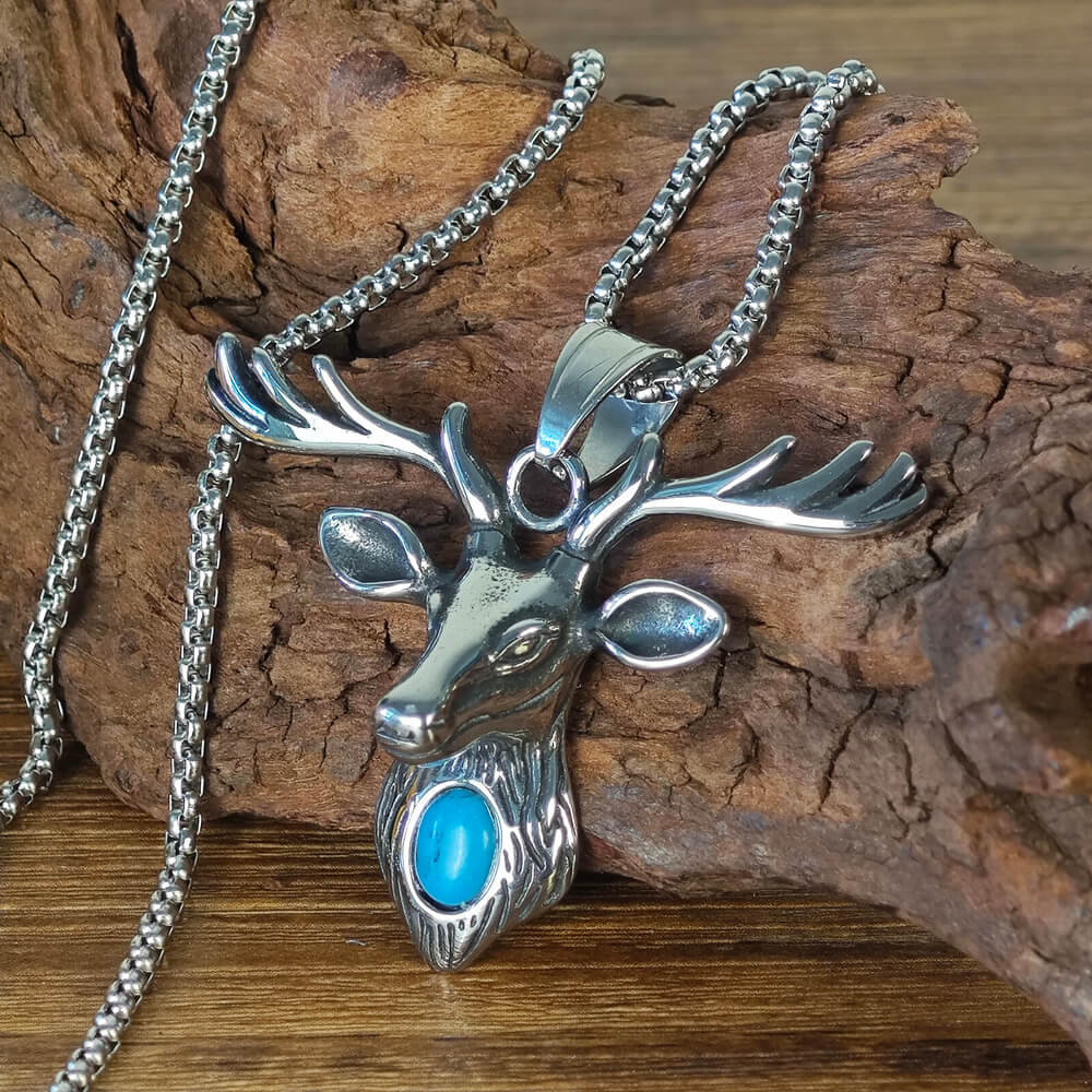 A silver necklace in the shape of a deer head