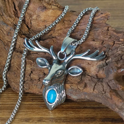 A silver necklace in the shape of a deer head