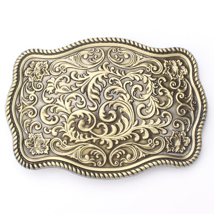Bronze arabic-style belt buckle with detailed arabesque engraving.