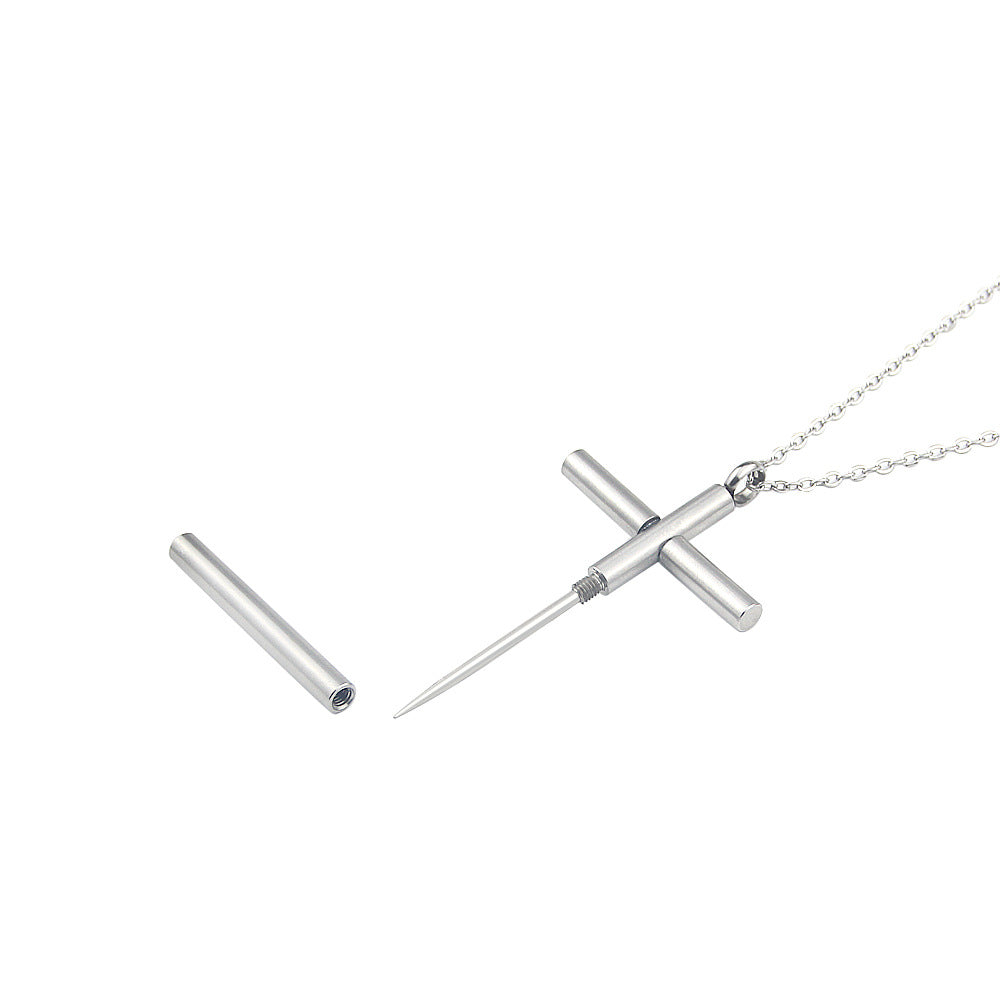 Alternative angle of opened cross necklace revealing protective spike.
