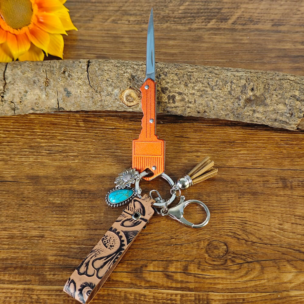 Red cowboy-style keychain with Western engraving


