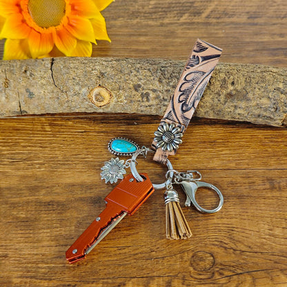 Red cowboy-style keychain with Western engraving